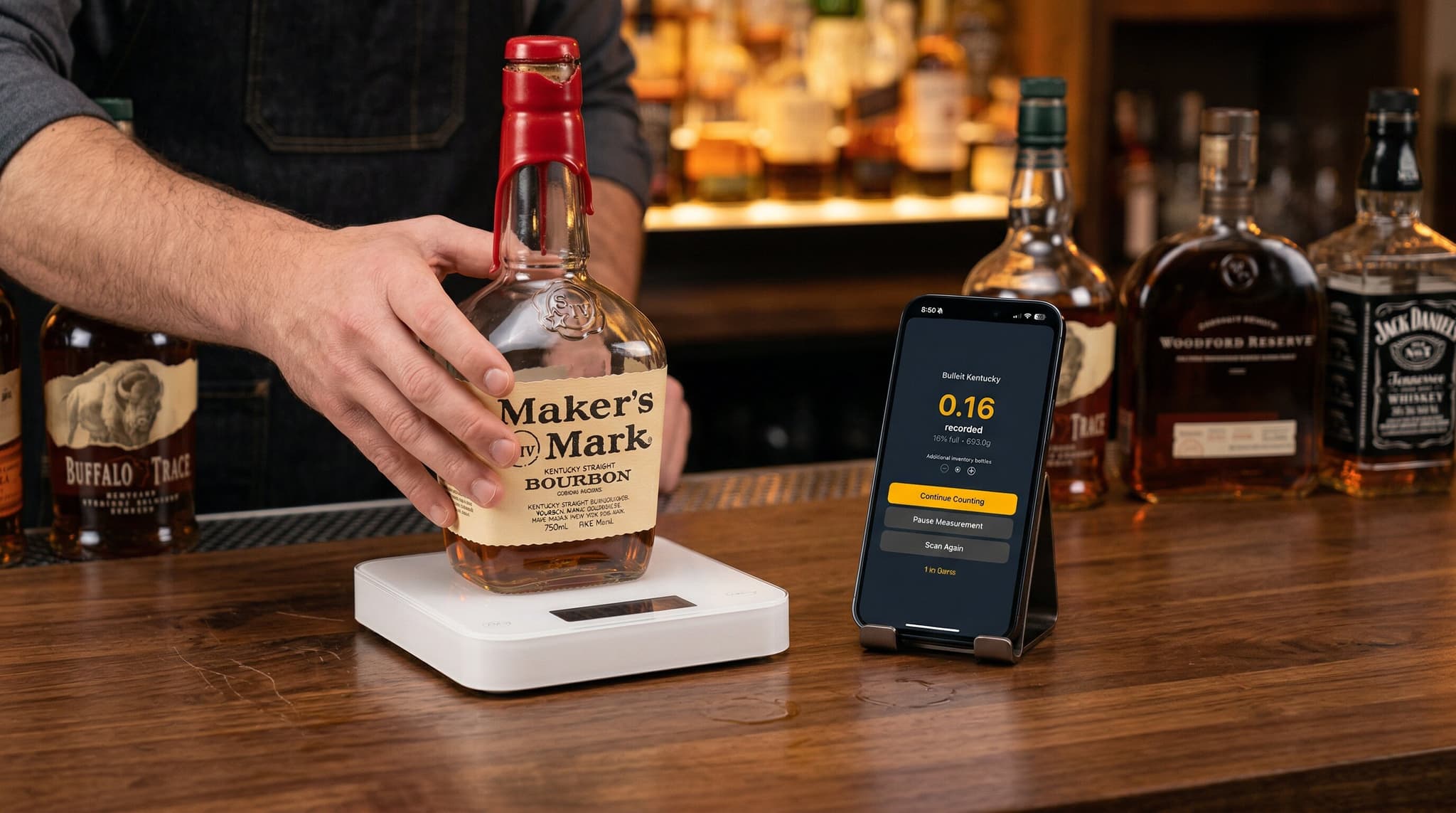 Bartender taking inventory bottle by bottle along a bar shelf